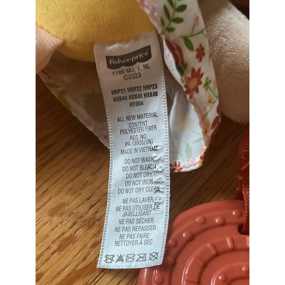 Fisher-Price Plush Baby Doll With Teether Rattle & Floral Skirt - Picture 2 of 4